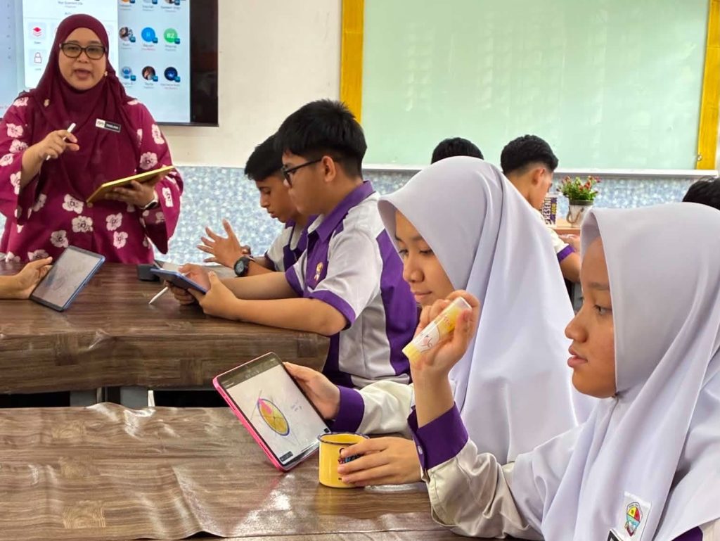 Students at Sekolah Berasrama Penuh Integrasi Gombak (INTEGOMB), a boarding school in Malaysia, use iPads across different subjects, including mathematics, languages, physical education, and science projects.